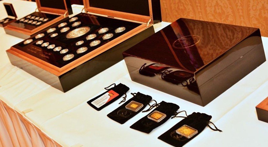 Wooden cases with coins and bars based on motifs by Joe Muczka jr.