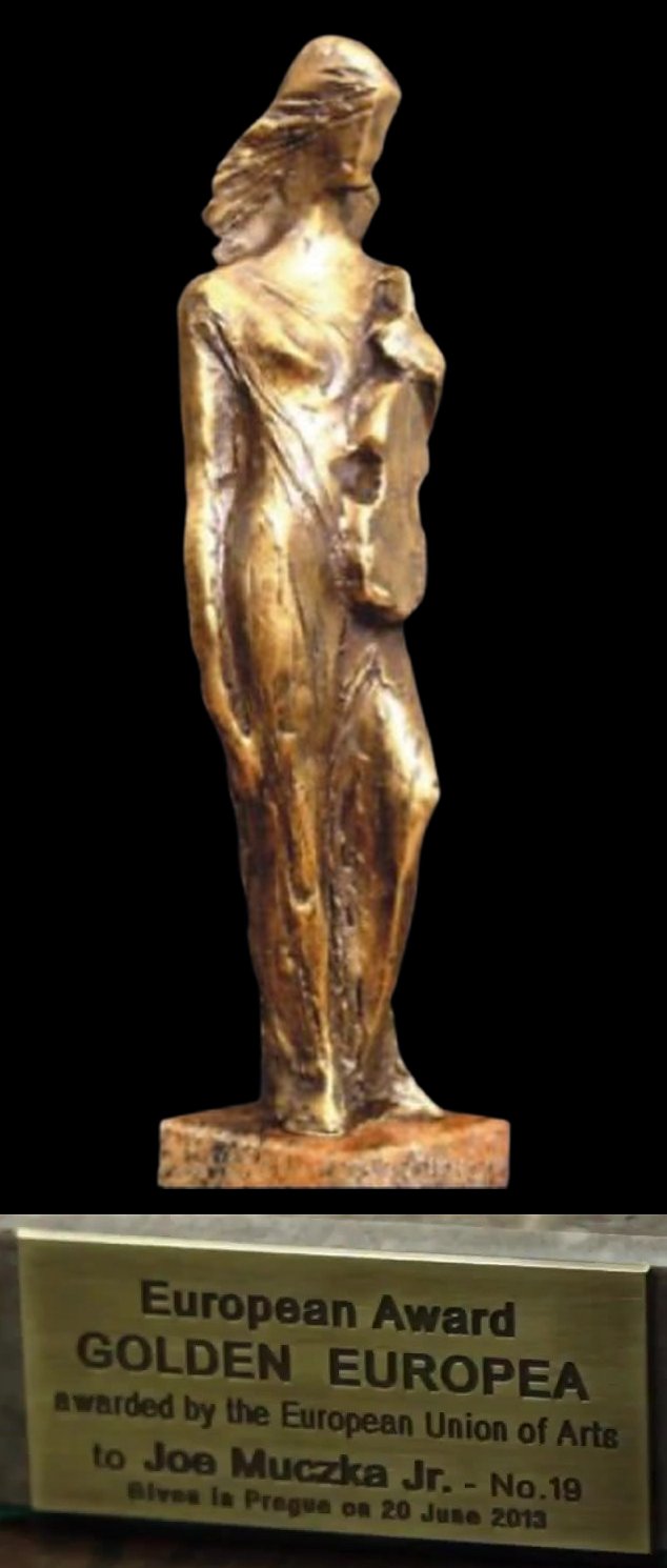 The statue of the Golden Europea, with the plaque below: European Award Golden Europea, awarded by the European Union of Arts to Joe Muczka Jr., No. 19, given in Prague on 20 June 2013